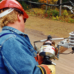 Crimper in use by lineman