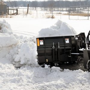 skid steer with v plow blade attachment