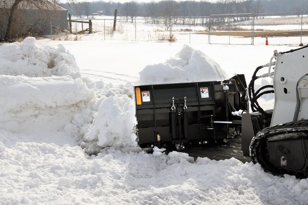 skid steer with v plow blade attachment
