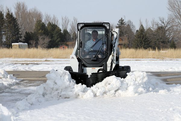 skid steer with v plow blade attachment for tough winters lots of snow