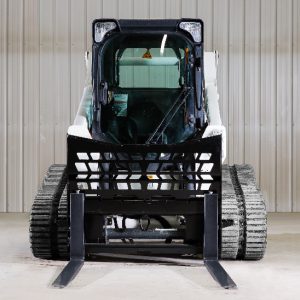 pallet forks attached to a bobcat skid steer