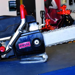 gas powered chain saw on counter ready to rent